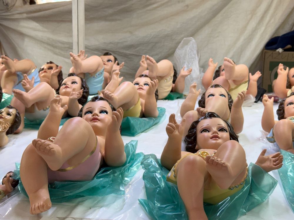 Baby Jesus figurines rest on their backs on Jan. 27 at a Mexico City market that sells the plaster representations of the Christ Child to be presented at church for a blessing on Candlemas, Feb. 2. (Anita Snow)
