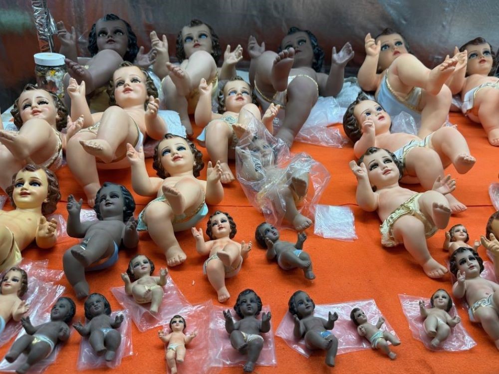 Baby Jesus figurines are displayed Jan. 27 at a Mexico market where the plaster dolls are sold, repaired and dressed for a blessing at church on Candlemas, celebrated Feb. 2 to mark 40 days after the birth of the Christ Child and his presentation at the temple. (Anita Snow) 