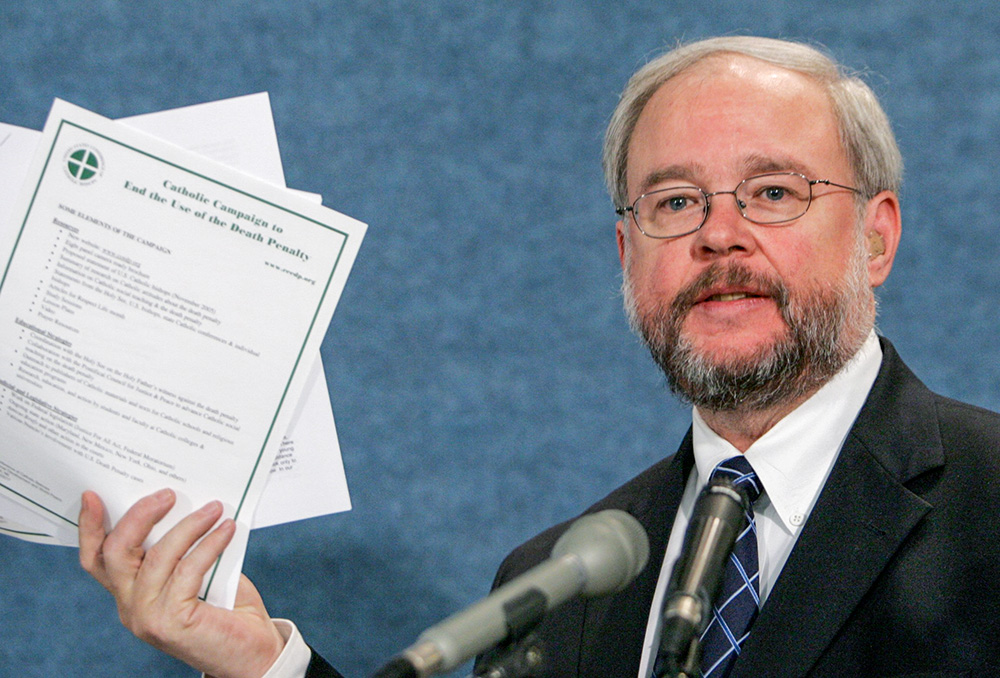 John Carr, then executive director of the U.S. bishops' Department of Justice, Peace and Human Development, speaks at a press conference in Washington in 2005. (CNS/Paul Haring) 