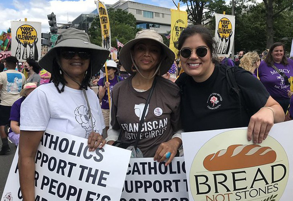 Charlene Howard, then-chairwoman of the Pax Christi USA national council, Josie Garnem, a national council member, and Lauren Bailey, the organization's national field organizer, pose during a demonstration in Washington June 18, 2022. (CNS/Courtesy of Pax Christi USA)