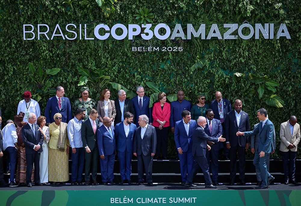 Brazil's President Luiz Inacio Lula da Silva greets Spain's Prime Minister Pedro Sanchez Nov. 7, 2025, as they and other delegates attending the Belem Climate Summit gather for a family photo in Belem, Brazil, ahead of the United Nations Climate Change Conference, or COP30, taking place Nov. 10-21. (OSV News/Reuters/Adriano Machado)
