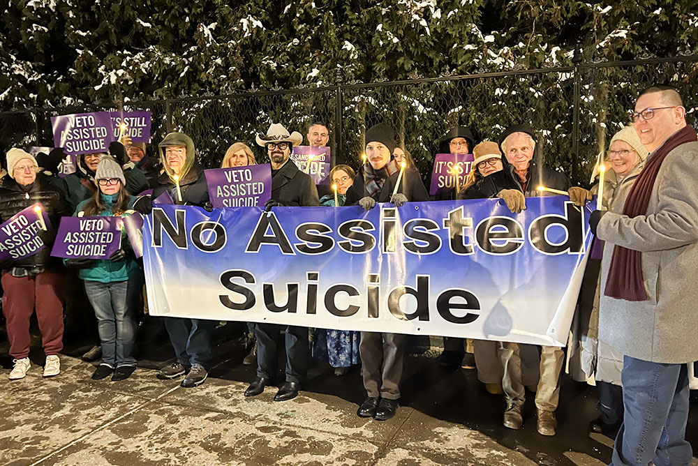 Opponents of New York state's proposed assisted suicide bill stand outside the governor's mansion in Albany, Dec. 3, 2025, for a candlelight vigil urging Gov. Kathy Hochul to veto the bill passed by the Legislature June 9. Hochul announced Dec. 17 that she would sign an amended bill in January. (OSV News/The Evangelist/Emily Benson)