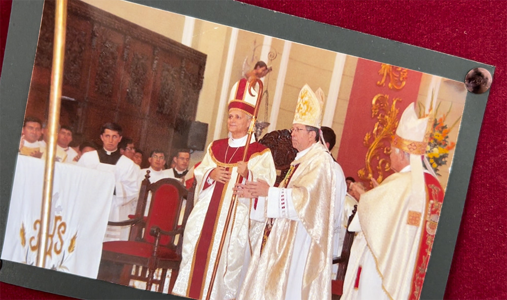 A photo of Bishop Robert Prevost's ordination Mass from Dec. 12, 2014, is displayed in the offices of the Diocese of Chiclayo, Peru in August 2025. American Archbishop James Green, Vatican ambassador to Peru, is seen to the right of the future pope. (NCR photo/Justin McLellan)