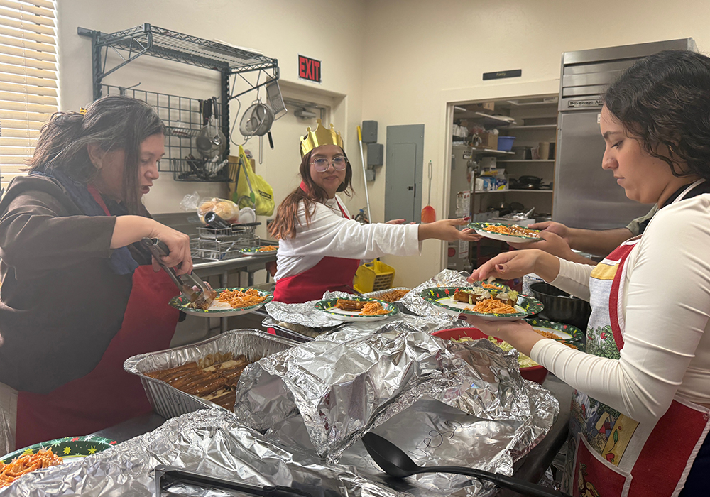 Volunteers with the group Salvavision prepare a Mexican meal for migrant families in the kitchen of a parish in Tucson, Arizona, during a Three Kings Day celebration on Jan. 4, 2026. (Anita Snow)