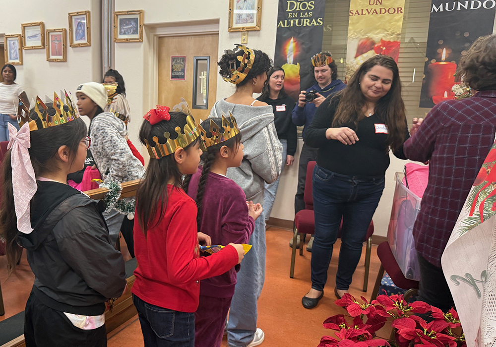 Migrant girls line up for gifts distributed to several dozen children during a Three Kings Day celebration organized by Salvavision in Tucson, Arizona, on Jan. 4, 2026. (Anita Snow)