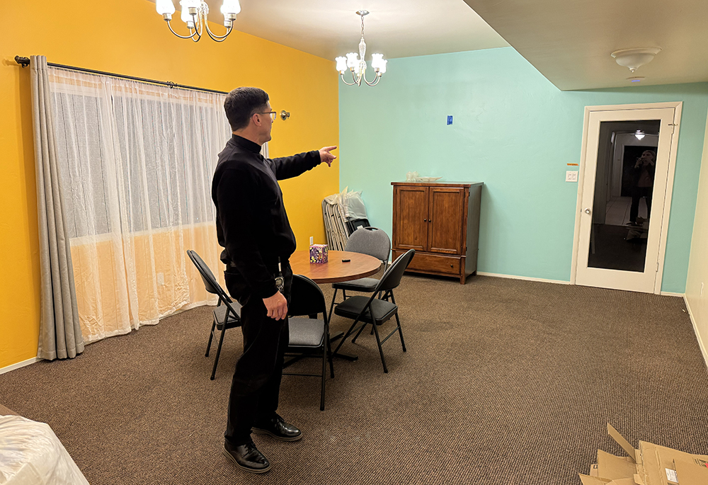 Jesuit Fr. Scott Santarosa, the pastor of Our Lady of Guadalupe Parish in San Diego, points out areas of the Pope Francis Center on a recent January evening. (Anna Weaver)