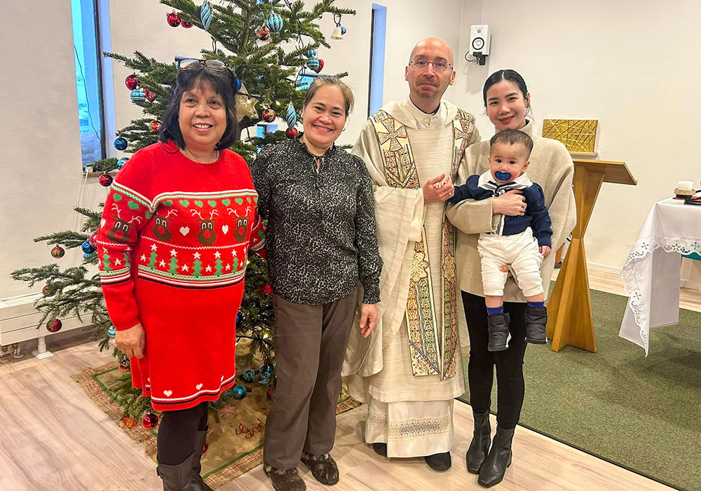 Maria Jacobsen, left, with three fellow Catholic parishioners and Franciscan Conventual Fr. Tomaž Majcen, pastor of Christ the King Parish in Nuuk, Greenland, during Christmas 2024. (Courtesy of Tomaž Majcen)