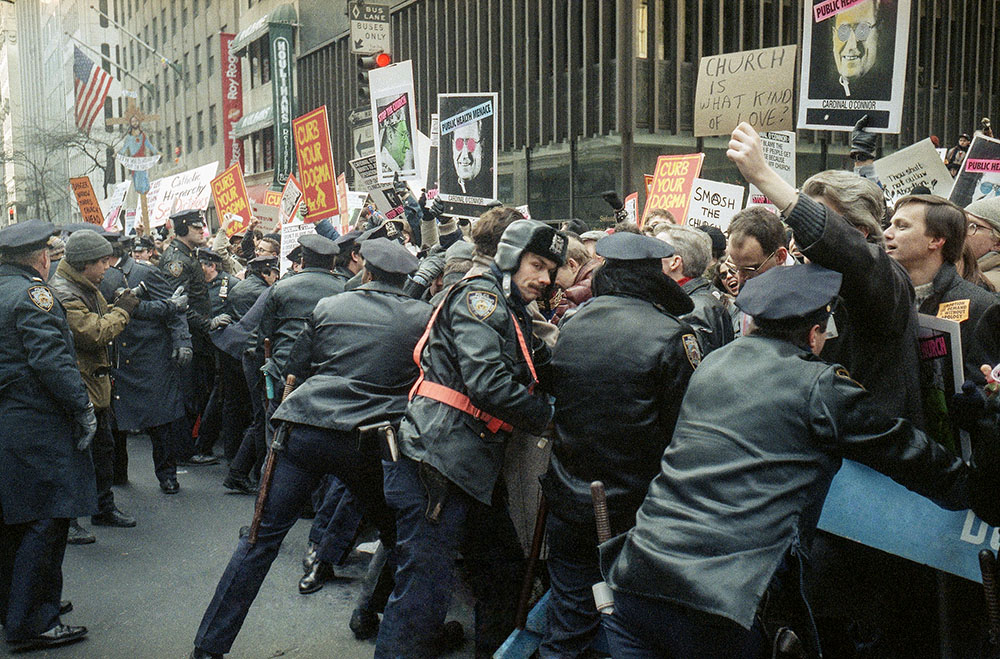 Police keep AIDS activists and pro-choice groups demonstrating outside of St. Patrick's Cathedral behind barriers, Dec. 10, 1989, in New York City. (AP/Frankie Ziths)