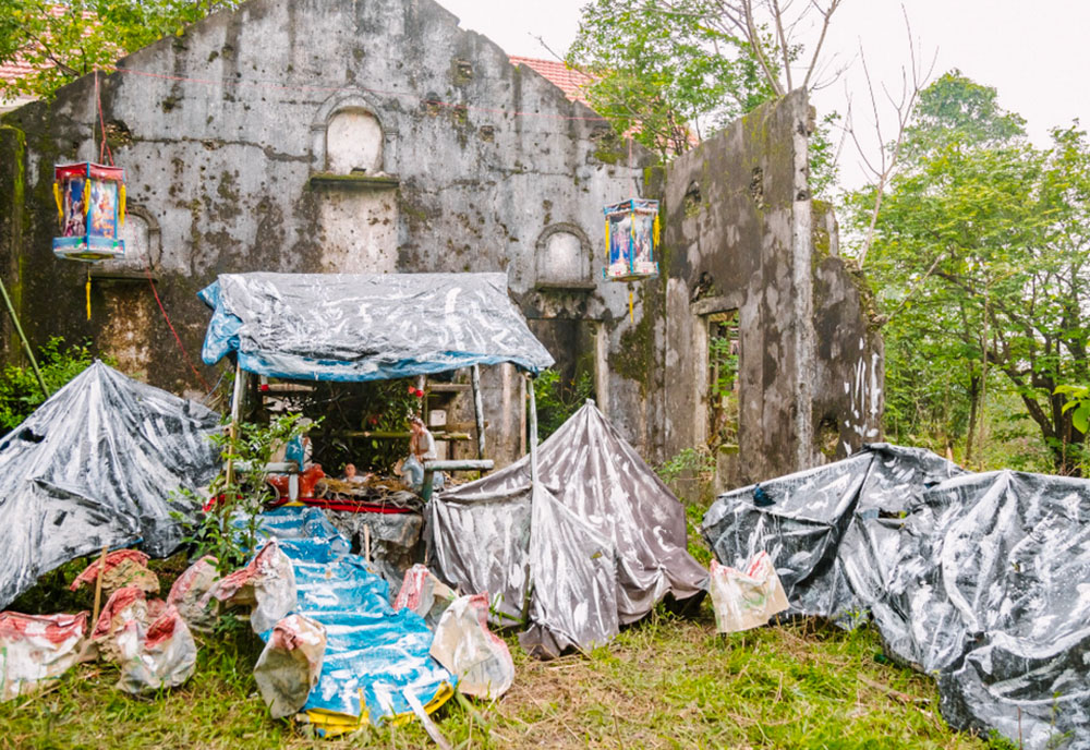 A Nativity scene built by the Daughters of Our Lady of the Visitation stands amid the remains of a chapel destroyed by Typhoon Bualoi in Mai Duong Sub-parish in Hue, Vietnam. (Joachim Pham)