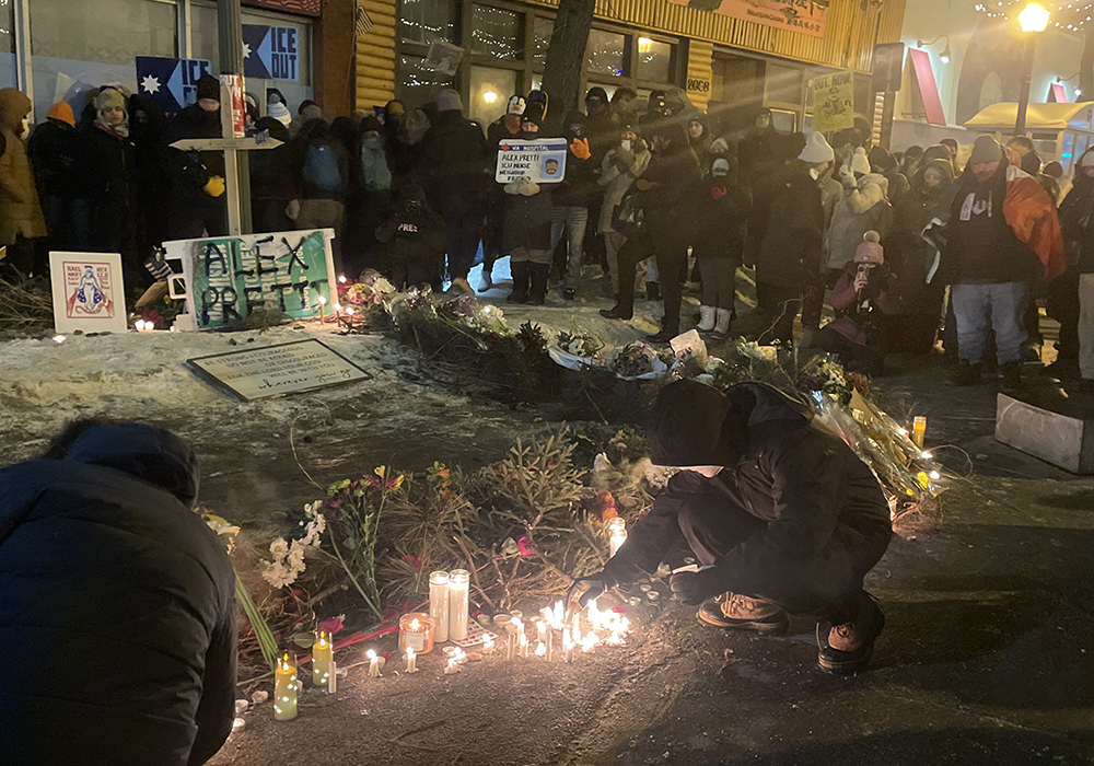 Participants gather at makeshift shrine for Alex Pretti Jan. 24, 2026, at a vigil in Minneapolis. Pretti, 37, was fatally shot earlier that day by a U.S. Border Patrol agent. (Tim Montgomery)