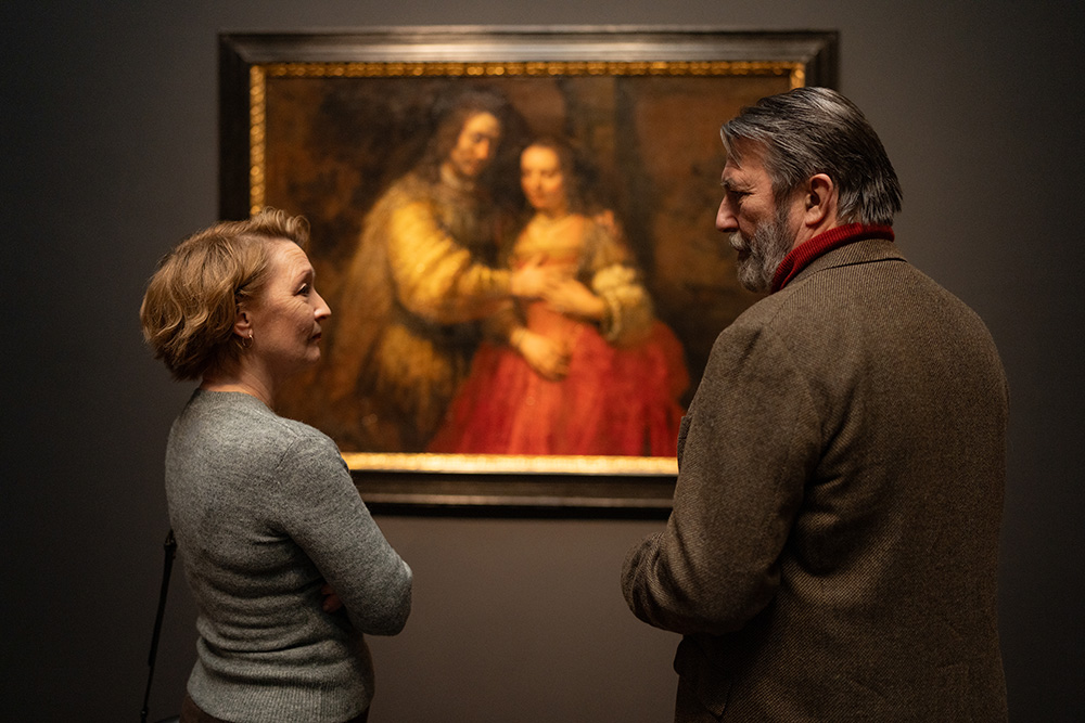 In a scene from the movie "Midwinter Break," Stella (Lesley Manville) and Gerry (Ciarán Hinds) survey "The Jewish Bride," a Rembrandt painting of Isaac and Rebecca that hangs in the Rijksmuseum, and see two separate but equally plausible meanings based on the circumstances of their own lives. (Focus Features/Mark de Blok)
