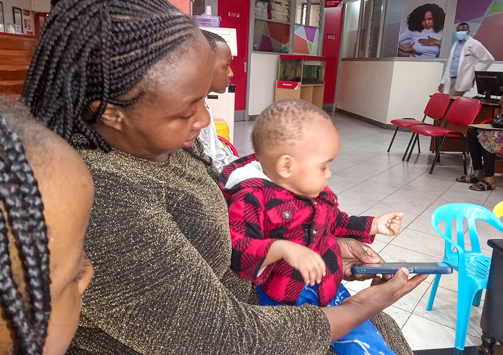 A Kenyan woman takes her 1-year-old son to the hospital for regular antenatal clinics. (Gitonga Njeru)