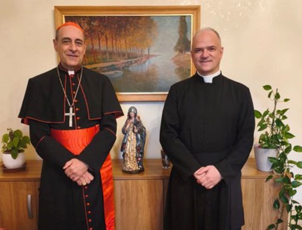 Cardinal Víctor Manuel Fernández, prefect of the Dicastery for the Doctrine of the Faith, and Fr. Davide Pagliarani, superior general of the traditionalist Society of St. Pius X, are pictured at the Vatican Feb. 12. (OSV News/Courtesy Dicastery for the Doctrine of the Faith)