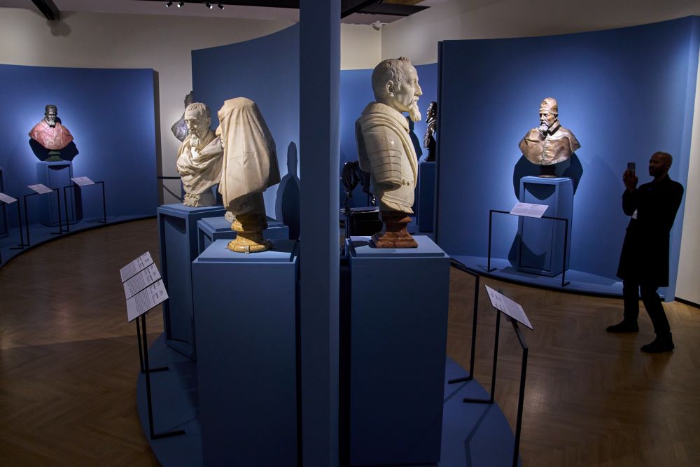 A journalist photographs marble statues by Italian Baroque master Gian Lorenzo Bernini, during the press preview of the exhibition "Bernini and the Barberini" at Palazzo Barberini in Rome on Feb. 11. (AP/Domenico Stinellis)