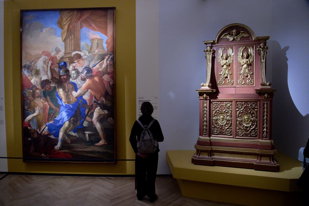 Journalists attend the press preview of the exhibition "Bernini and the Barberini" at Palazzo Barberini in Rome on Feb. 11. The exhibition includes the oil on canvas "Martyrdom of St. Maurice" (1640), left, by Carlo Pellegrini and Gian Lorenzo Bernini, and the model for the bronze casing of the Throne of St. Peter (1636) by Giovan Battista Soria. (AP/Domenico Stinellis)