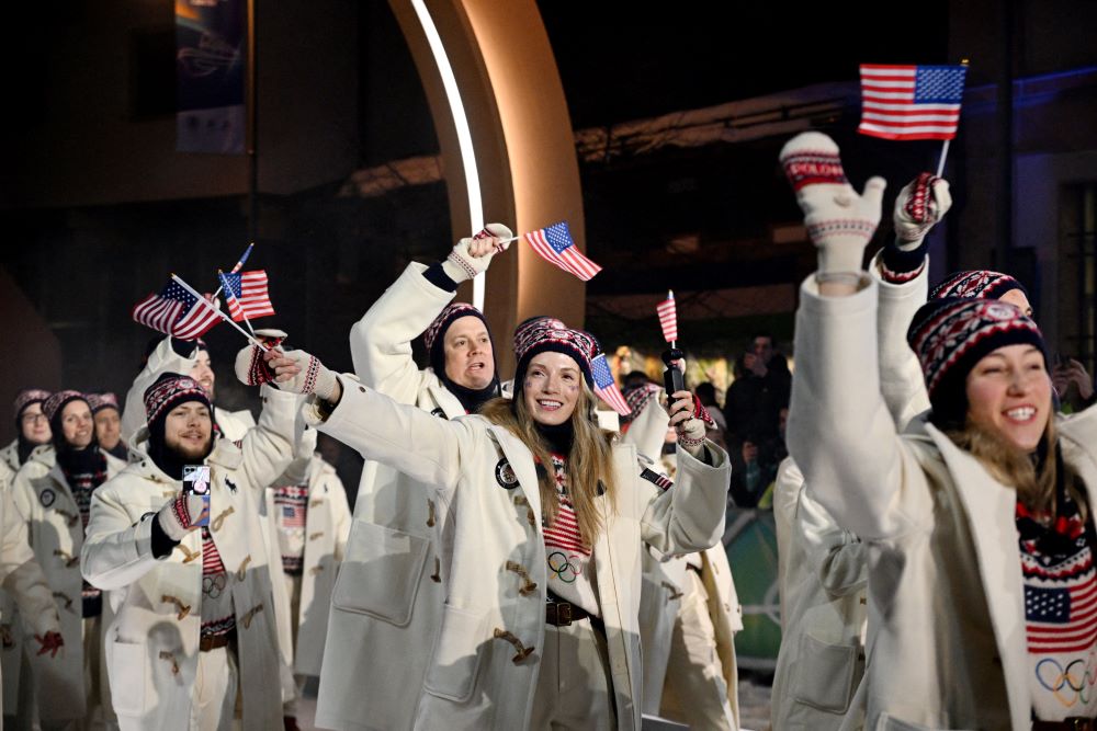 Athletes from the United States wave flags during the opening ceremony of the 2026 Milan Cortina Winter Olympics in Italy Feb. 6. (OSV News/Reuters/Jennifer Lorenzini)