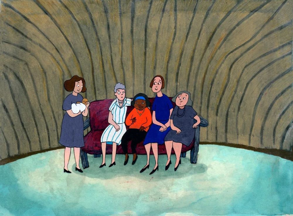 Several people sit on a couch with a Black little girl. A woman stands, holding a baby.