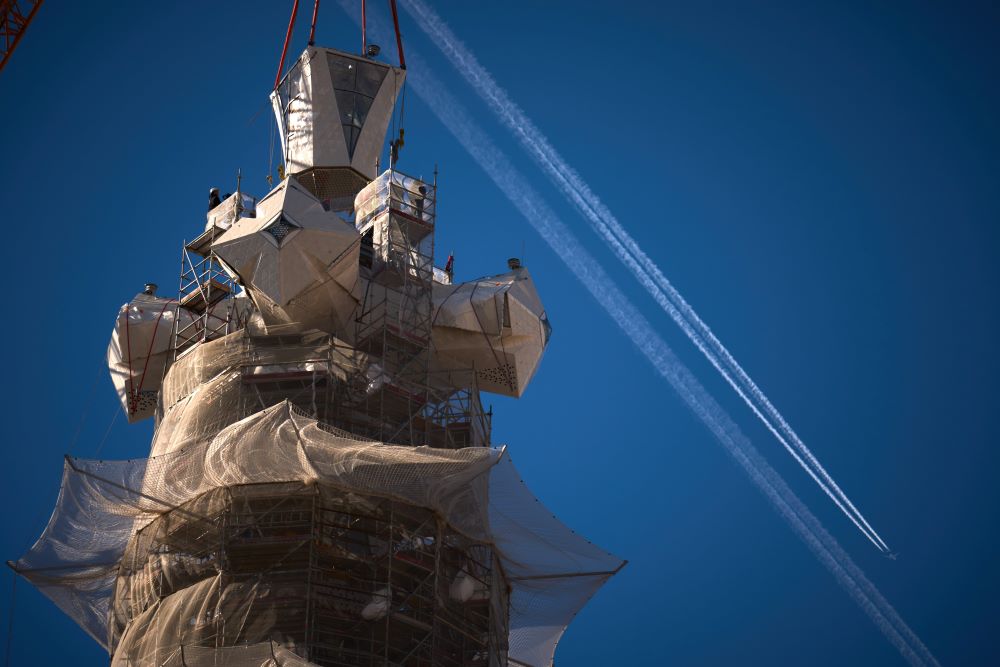 Barcelona's towering Sagrada Familia basilica reached its maximum height of 566 feet on Feb. 22 after a crane placed the upper arm of a cross atop the Tower of Jesus Christ. (AP/Emilio Morenatti)