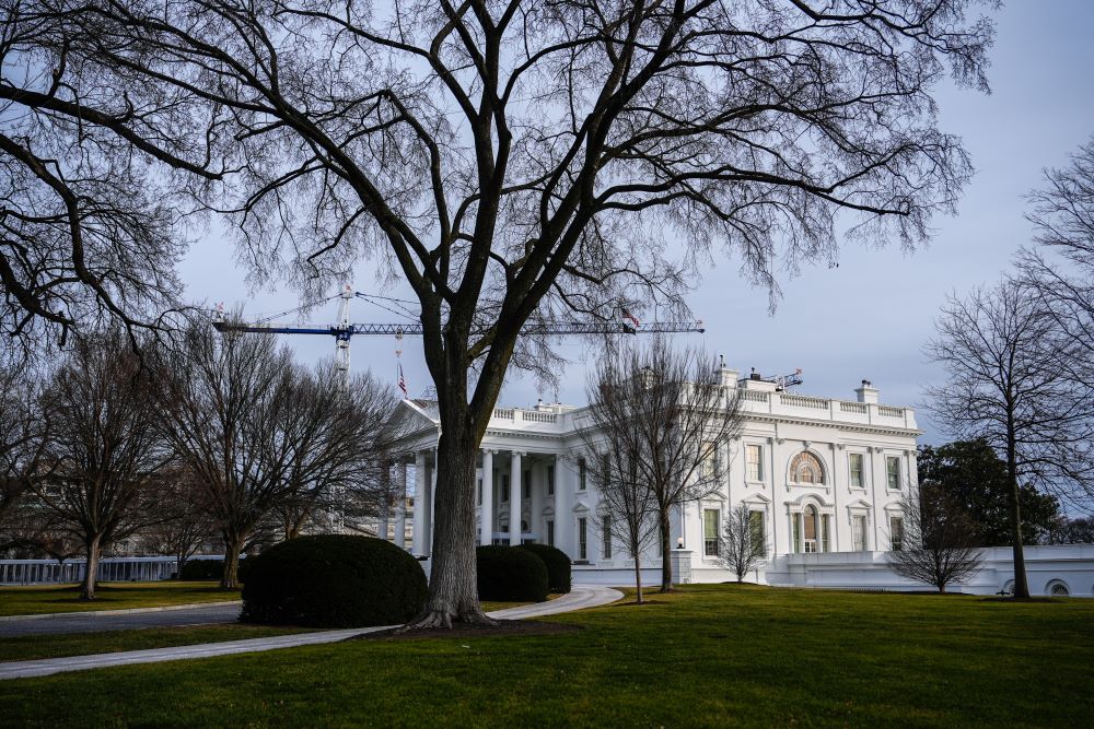 Construction cranes are seen over the White House Jan. 24 in Washington. (AP/Julia Demaree Nikhinson)