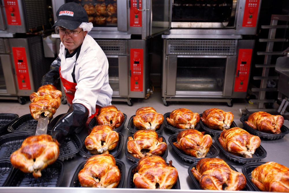 A Costco employee cooks chicken at Costco in Mountain View, Calif., March 3, 2010. The company has sold its rotisserie chicken for $4.99 since 2009. (AP/Paul Sakuma, file)