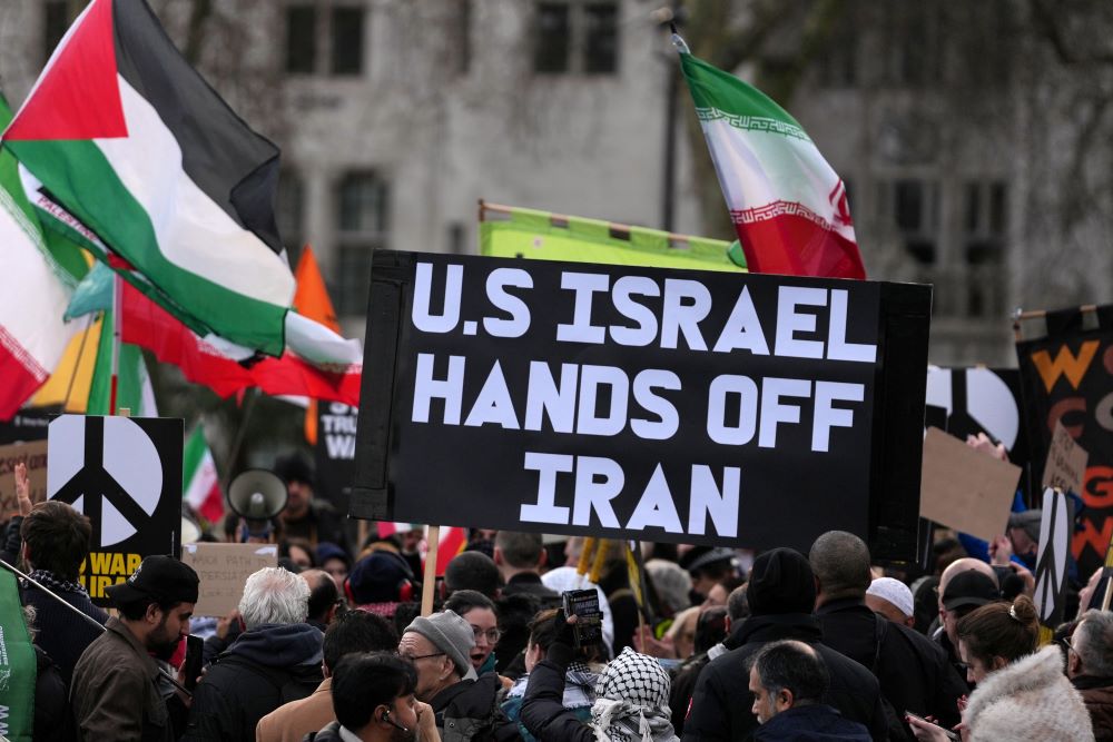Protesters gather in London Feb. 28 after U.S. and Israeli forces carried out a series of strikes on Iran on Saturday morning. (AP/Alastair Grant)
