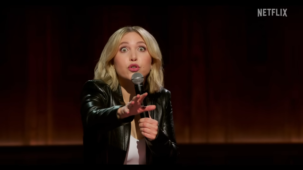 In her new Netflix special "Prodigal Daughter," Taylor Tomlinson's explores the comedian's religious anxieties, queerness and roots in church comedy. (NCR screen grab/Netflix/YouTube)