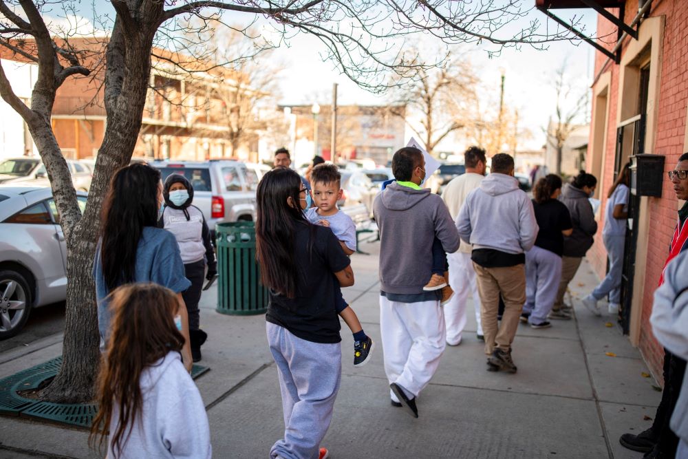 A family of migrants is dropped off by a transport contractor for the U.S. Customs and Border Protection at a shelter run by Annunciation House in downtown El Paso, Texas, Dec. 13, 2022. (OSV News/Reuters/Ivan Pierre Aguirre)