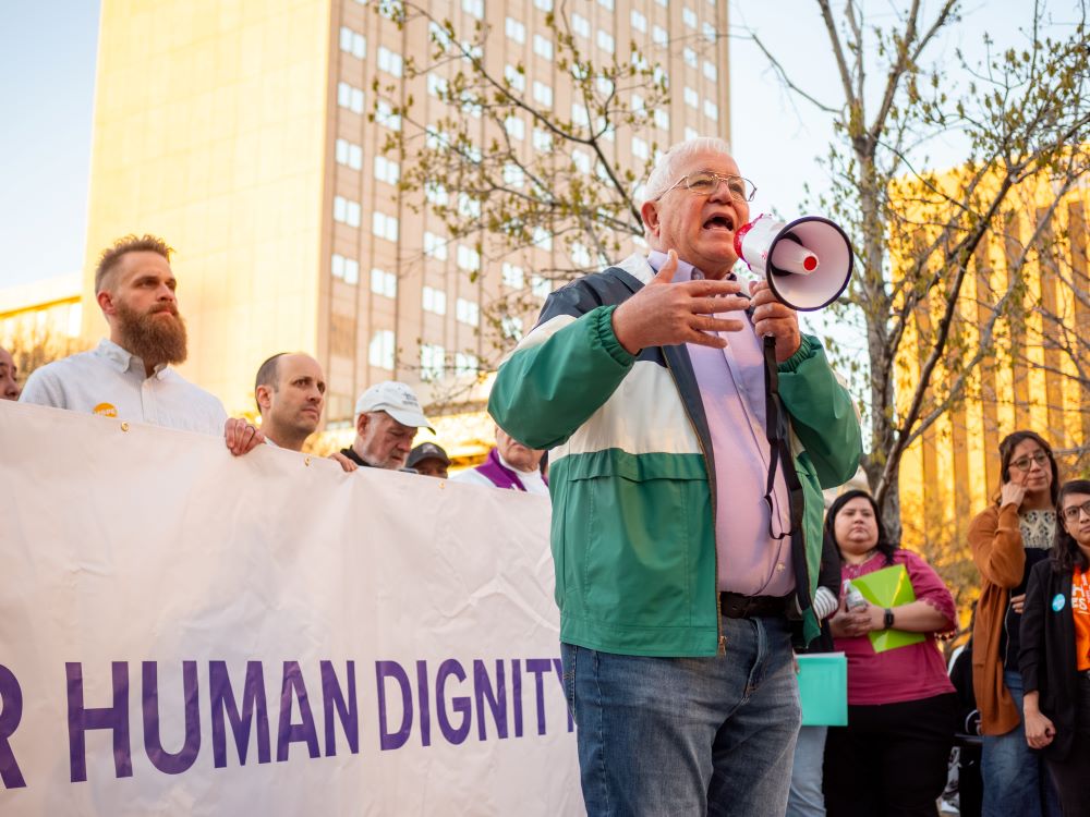 Ruben Garcia, executive director of Annunciation House, helps lead a March 2024 rally in El Paso, Texas, in support of immigrants. Texas Attorney General Ken Paxton has accused Annunciation House of "harboring illegal aliens" and serving as a "stash house" engaged in human smuggling. (Courtesy of Ruben Garcia)