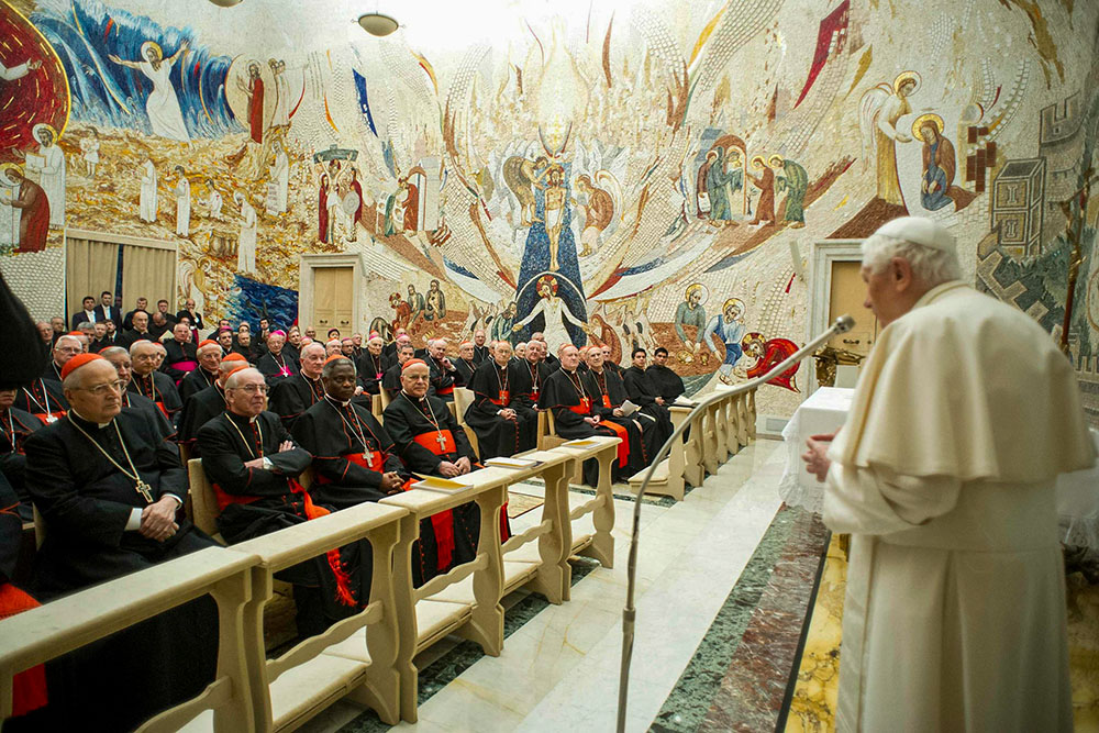 Pope Benedict XVI speaks to members of the Roman Curia during the closing day of a spiritual retreat at the Vatican Feb. 23, 2013. (CNS/L'Osservatore Romano via Reuters)