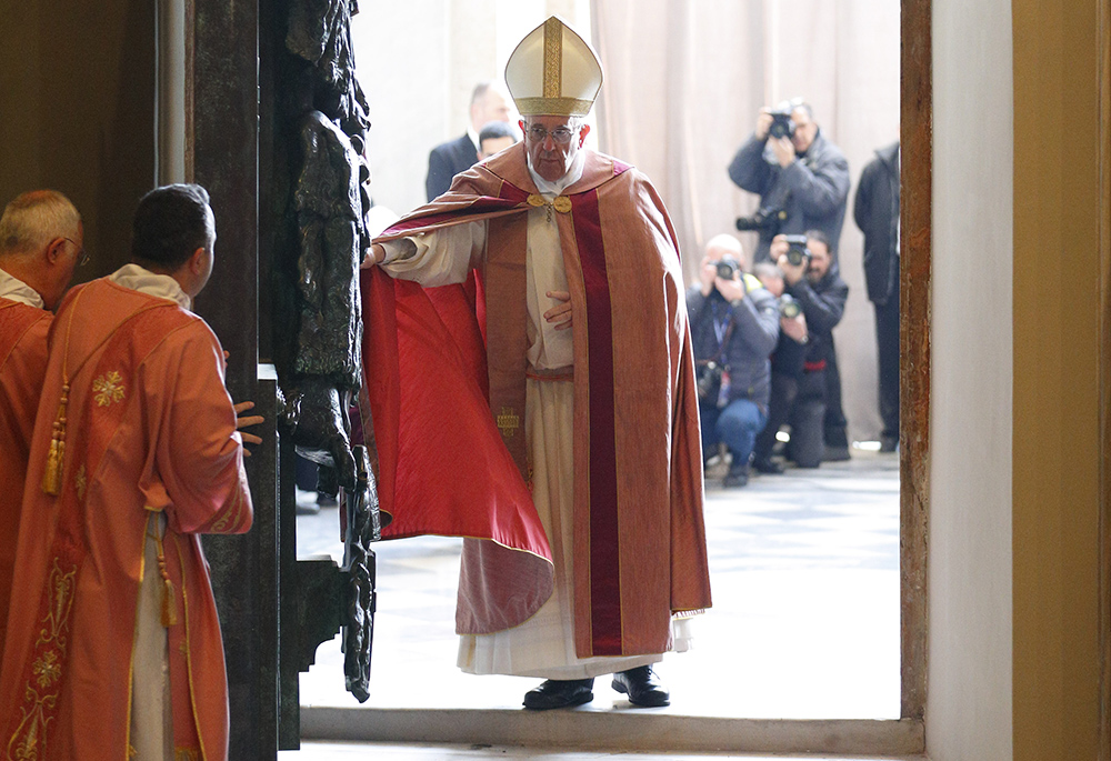 Pope Francis opens the Holy Door of the Basilica of St. John Lateran in Rome Dec. 13, 2015. Holy doors around the world were opened at city cathedrals, major churches and sanctuaries Dec. 13 as part of the Jubilee of Mercy. (CNS /Paul Haring)