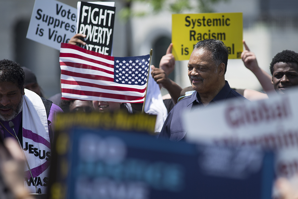 The Rev. Jesse Jackson and a number of religious leaders are seen near Capitol Hill in Washington May 21, 2018, during a protest to demand elected officials take immediate steps to confront systemic racism. Jackson died Feb. 17, 2026. (CNS/Tyler Orsburn)