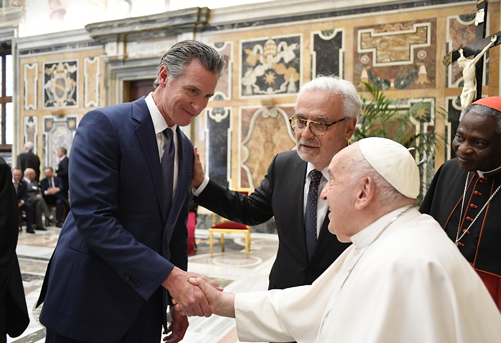 Pope Francis speaks with California Gov. Gavin Newsom during an audience in the Apostolic Palace at the Vatican May 16, 2024, with participants in a conference on climate resilience sponsored by the Pontifical Academy of Sciences and the Pontifical Academy of Social Sciences. (CNS/Vatican Media)