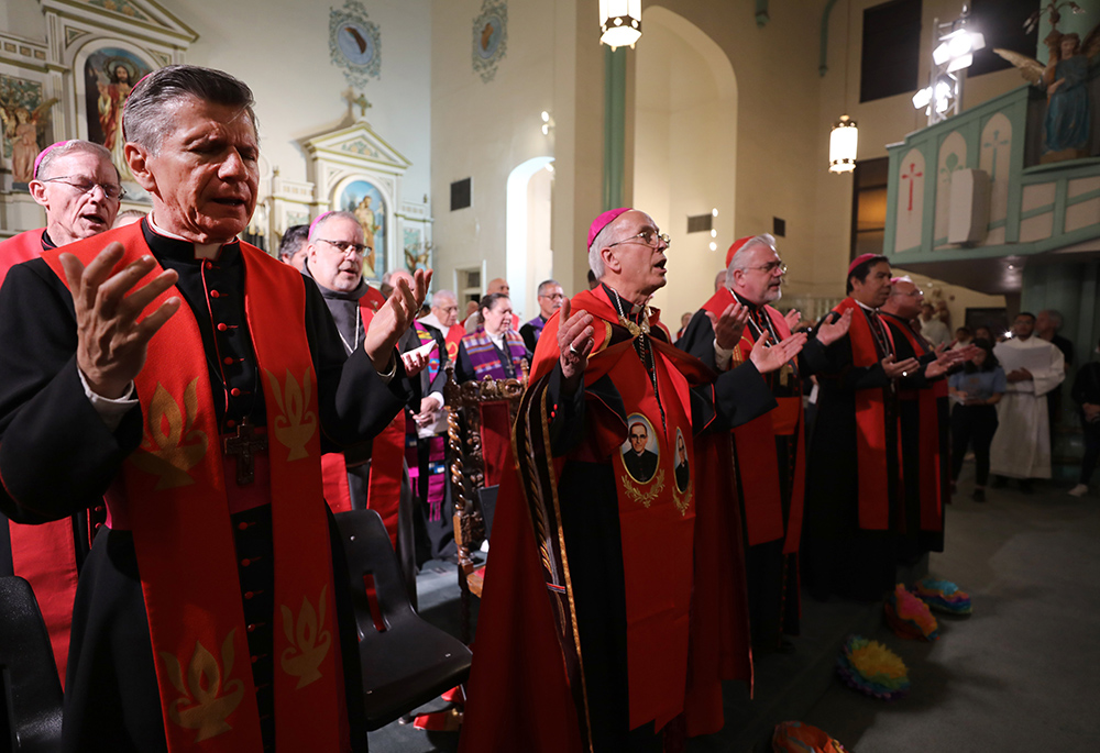 Archbishop Gustavo García-Siller of San Antonio; Archbishop John C. Wester of Santa Fe, New Mexico, back left, Bishop John E. Stowe of Lexington, Kentucky; Bishop Mark J. Seitz of El Paso, Texas, front center, and Cardinal Fabio Baggio of Bassano del Grappa, Italy, the undersecretary of the Vatican's Dicastery for Promoting Integral Human Development, and other prelates pray during a vigil at Sacred Heart Church in El Paso March 24, 2025, following a rally and march protesting mass deportations. (OSV News)