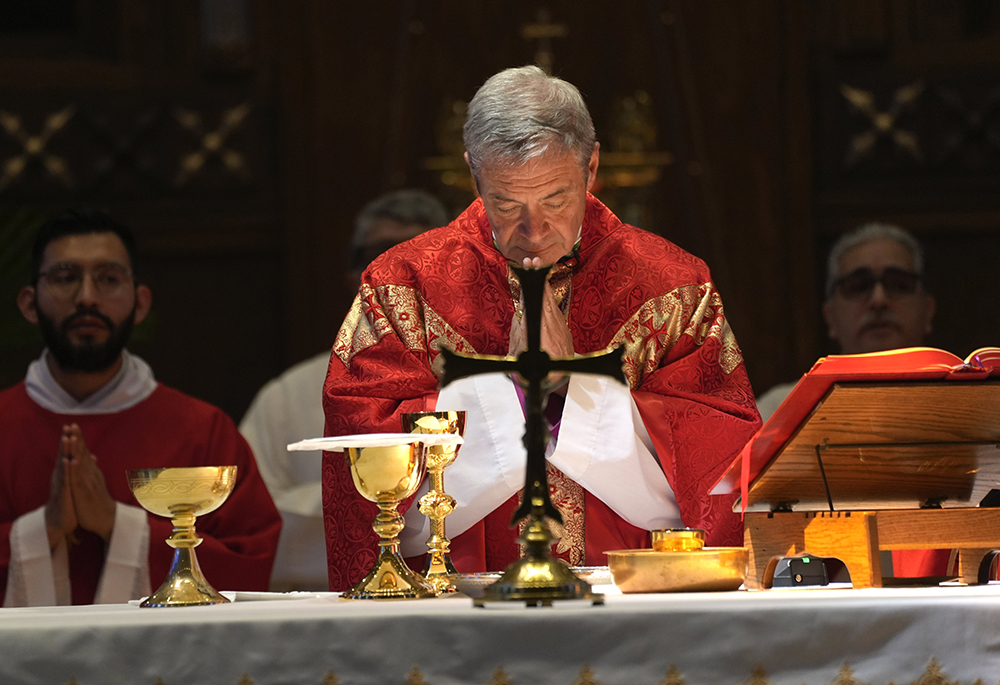Bishop Robert J. Brennan of Brooklyn bows his head in prayer as he celebrates a Mass marking the opening of the papal conclave at Immaculate Conception Center in the Douglaston section of Queens, New York, May 7, 2025. (OSV News/Gregory A. Shemitz)