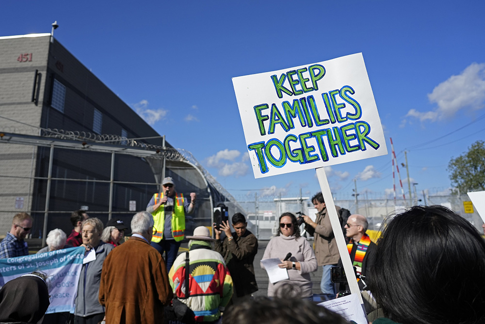 People gather for a pro-immigrant prayer vigil outside Delaney Hall, a migrant detention center in Newark, N.J., Oct. 22, 2025. The event was affiliated with the nationwide "One Church, One Family: Catholic Public Witness for Immigrants" initiative. (OSV News/Gregory A. Shemitz)