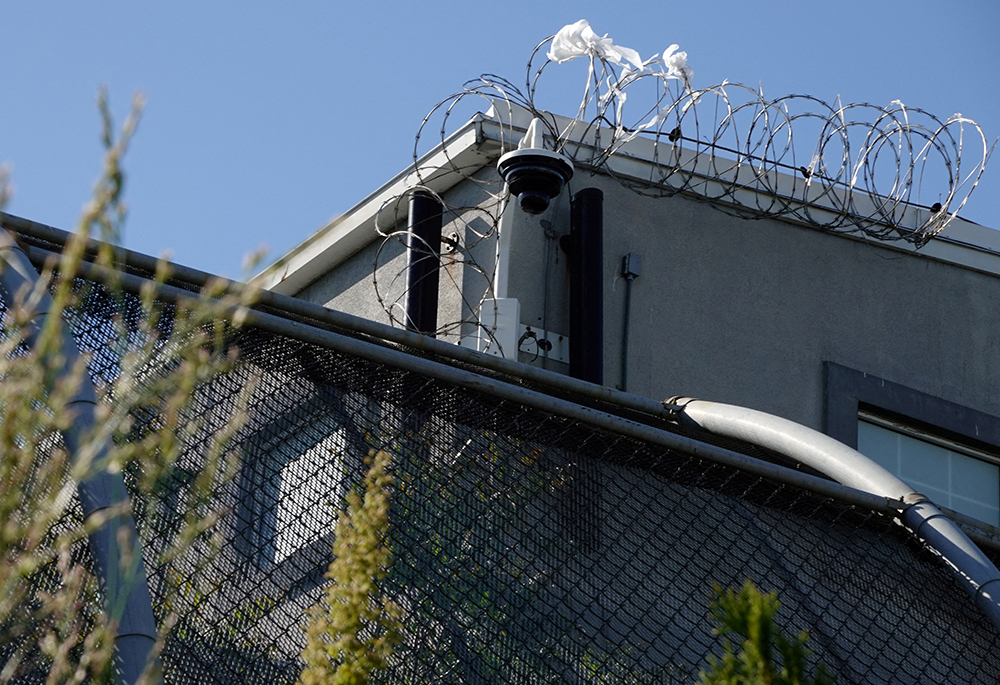 A surveillance camera sits outside of Delaney Hall, a 1,000-person detention center operated by private prison company GEO Group for Immigration and Customs Enforcement (ICE), in the Ironbound neighborhood of Newark, New Jersey, May 10, 2025. (OSV News/Reuters/Bing Guan)