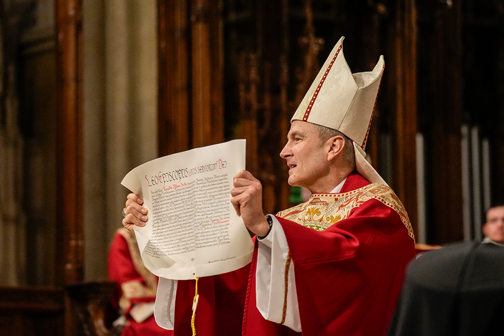 Archbishop Ronald Hicks holds the apostolic mandate from Pope Leo XIV appointing him as the new archbishop of New York during his installation Mass at St. Patrick's Cathedral in New York City Feb. 6, 2026. (OSV News/Gregory A. Shemitz)
