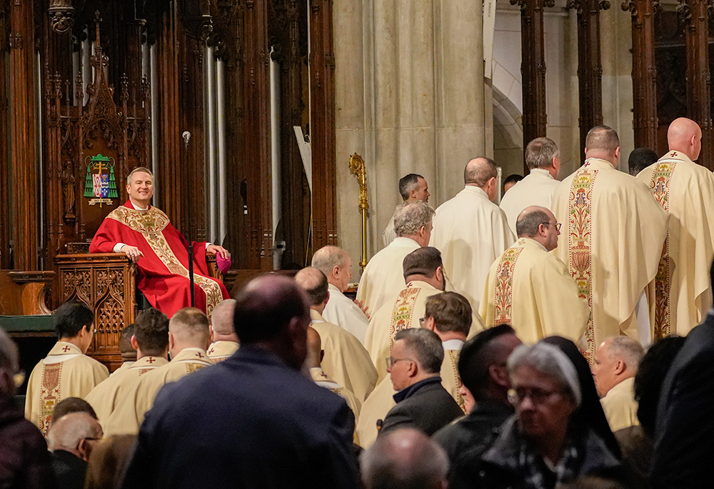 Archbishop Ronald Hicks looks on as priests enter the sanctuary to receive Communion during his installation Mass as the new archbishop of New York at St. Patrick's Cathedral in New York City Feb. 6, 2026. (OSV News/Gregory A. Shemitz)