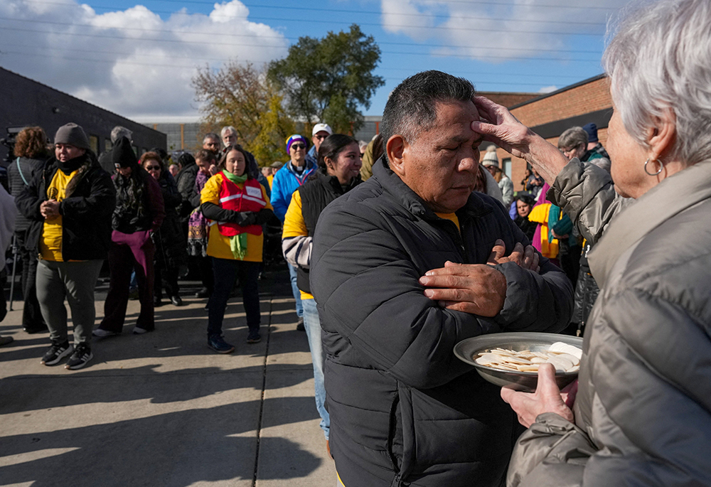 A man receives a blessing during an outdoor Mass Nov. 1, 2025, held outside the Immigration and Customs Enforcement facility in Broadview, Illinois. U.S. District Judge Robert W. Gettleman in Chicago granted a preliminary injunction Feb. 12, 2026, that allows clergy, religious and Catholic social justice advocates to enter the ICE facility on Ash Wednesday Feb. 18 to offer ashes and holy Communion to detained Catholics. (OSV News/Reuters/Leah Millis)