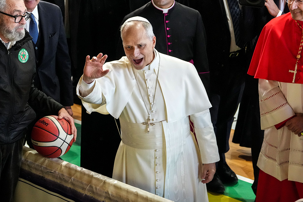 Pope Leo XIV greets children gathered in a gymnasium during his pastoral visit to the Parish of Santa Maria Regina Pacis in Ostia Lido, Italy, Feb. 15, 2026. (CNS/Lola Gomez)