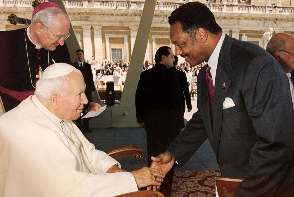 The Rev. Jesse Jackson greets Pope John Paul II at the end of the pope's weekly audience at the Vatican June 23, 1999. Jackson attended the audience during his two-day visit to Italy. Jackson died Feb. 17, 2026. (CNS/Vatican)