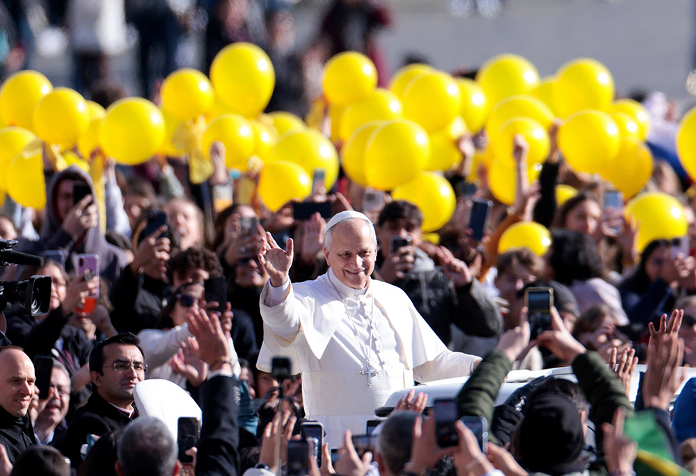 Pope Leo XIV waves to the faithful as he arrives to hold the general audience in St. Peter's Square at the Vatican, Feb. 18, 2026. (OSV News/Reuters/Remo Casilli)