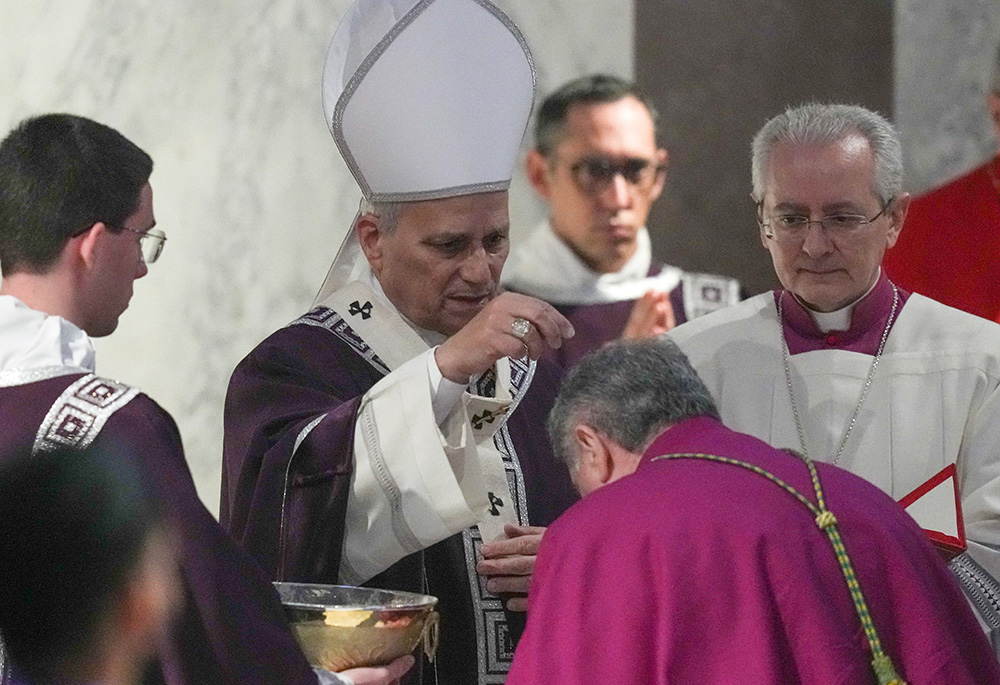 Pope Leo XIV sprinkles ashes during Ash Wednesday Mass at the Basilica of Santa Sabina in Rome Feb. 18, 2026. (CNS/Lola Gomez)