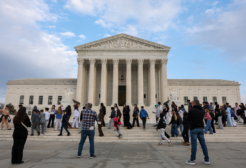 People walk near the U.S. Supreme Court in Washington Feb. 25, 2026. The U.S. Conference of Catholic Bishops is among the organizations that filed amicus briefs Feb. 26, 2026, opposing President Donald Trump's effort to change birthright citizenship. The court is scheduled to hear oral arguments in the case, Trump v. Barbara, April 1. (OSV News/Reuters/Kylie Cooper)