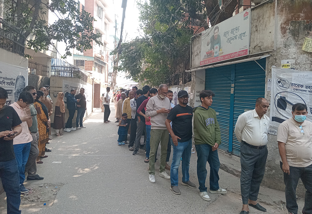 People wait in line on Feb. 12, 2026, to vote inside a Maryknoll sister-run school, the Bacha English Medium School, in Monipuripara, Tejgaon, in Dhaka, Bangladesh. (Sumon Corraya)