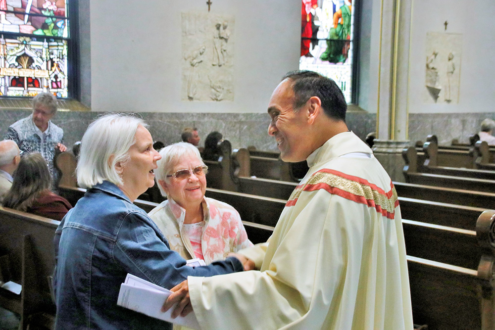 Paulist Fr. René Constanza, president of the Paulist Fathers, greets parishioners in Grand Rapids, Michigan, in 2024. (Courtesy of Paulist Fathers)