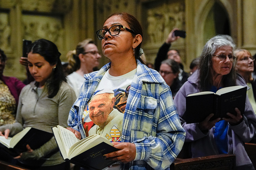 Parishioners pray during a Mass for Pope Francis at St. Patrick's Cathedral in New York, on April 22, 2025, the day after Francis' death. (AP/Julia Demaree Nikhinson)