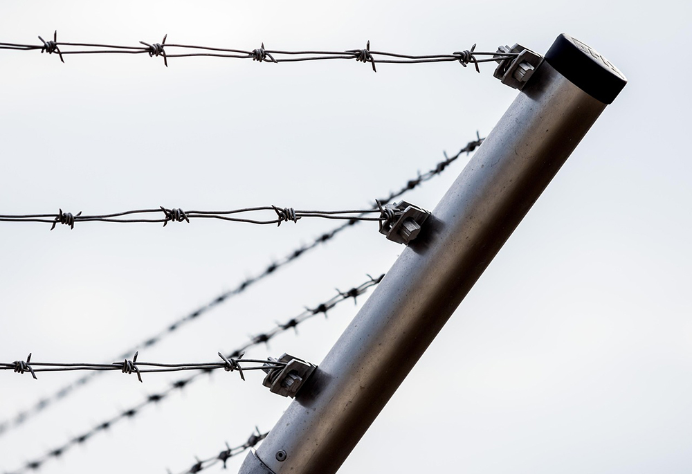 Barbed wire roping around a corner is shown in a close-up photo illustration. (Pixabay)