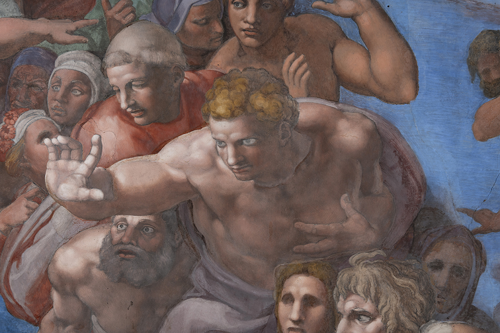 A detail from Michelangelo's "The Last Judgment" shows the surface before and after the Vatican Museums' extraordinary maintenance on the fresco, which removed a thin layer of calcium lactate buildup. (Courtesy of the Governorate of Vatican City State)