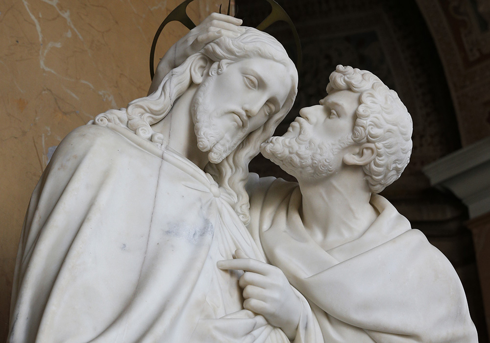 Judas kisses Jesus in this statue at the base of the Holy Stairs in Rome in this March 10, 2014, file photo. Tradition maintains that Jesus climbed the stairs when Pilate brought him before the crowd. It's believed that Constantine's mother, St. Helen, brought the stairs to Rome from Jerusalem in 326. (CNS/Paul Haring)
